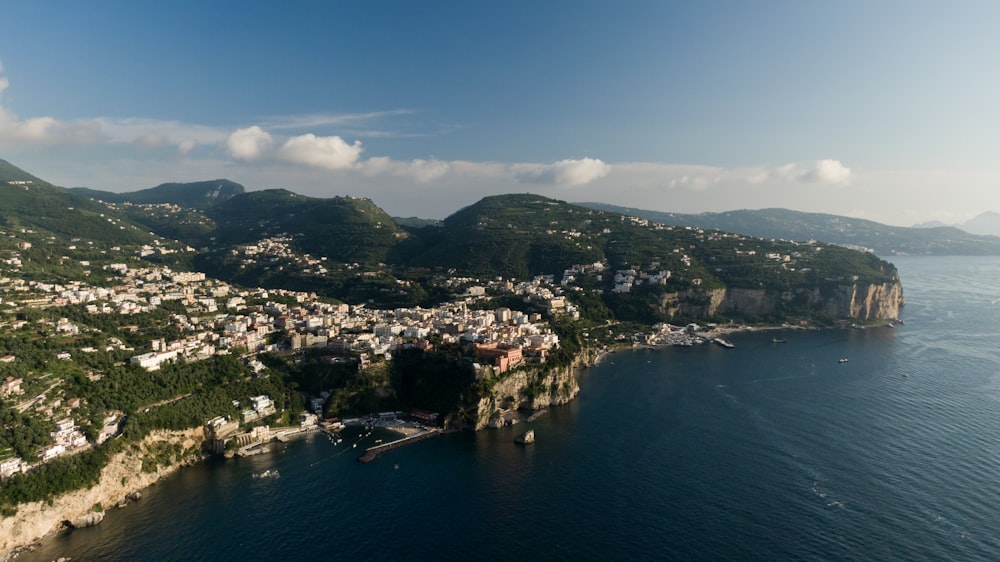 an aerial view of a city on the coast