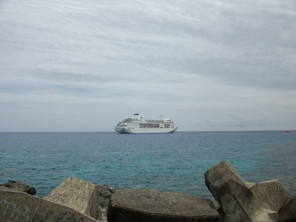 a cruise ship in the distance on the ocean