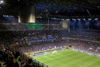 a stadium full of people watching a soccer game