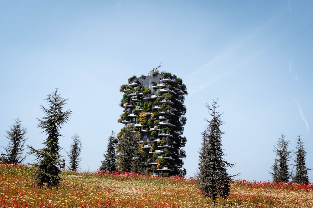 a tall tower with plants growing out of it