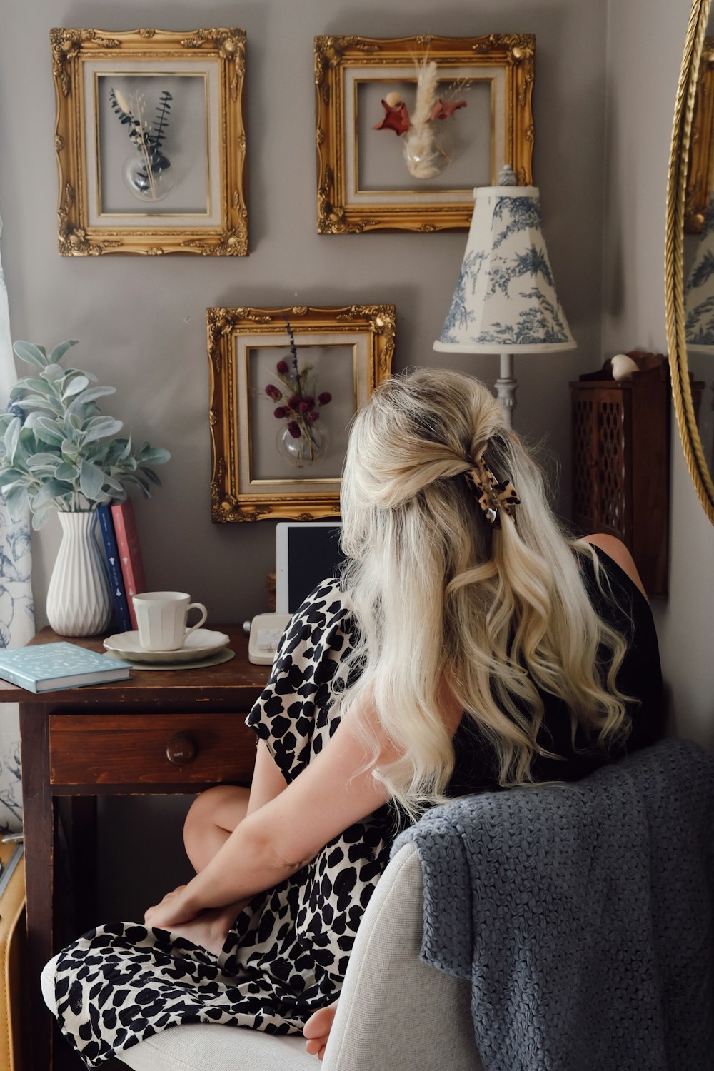 a woman sitting on a chair in a room