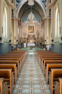 Church interior gleaming after thorough cleaning, highlighting polished pews and altar