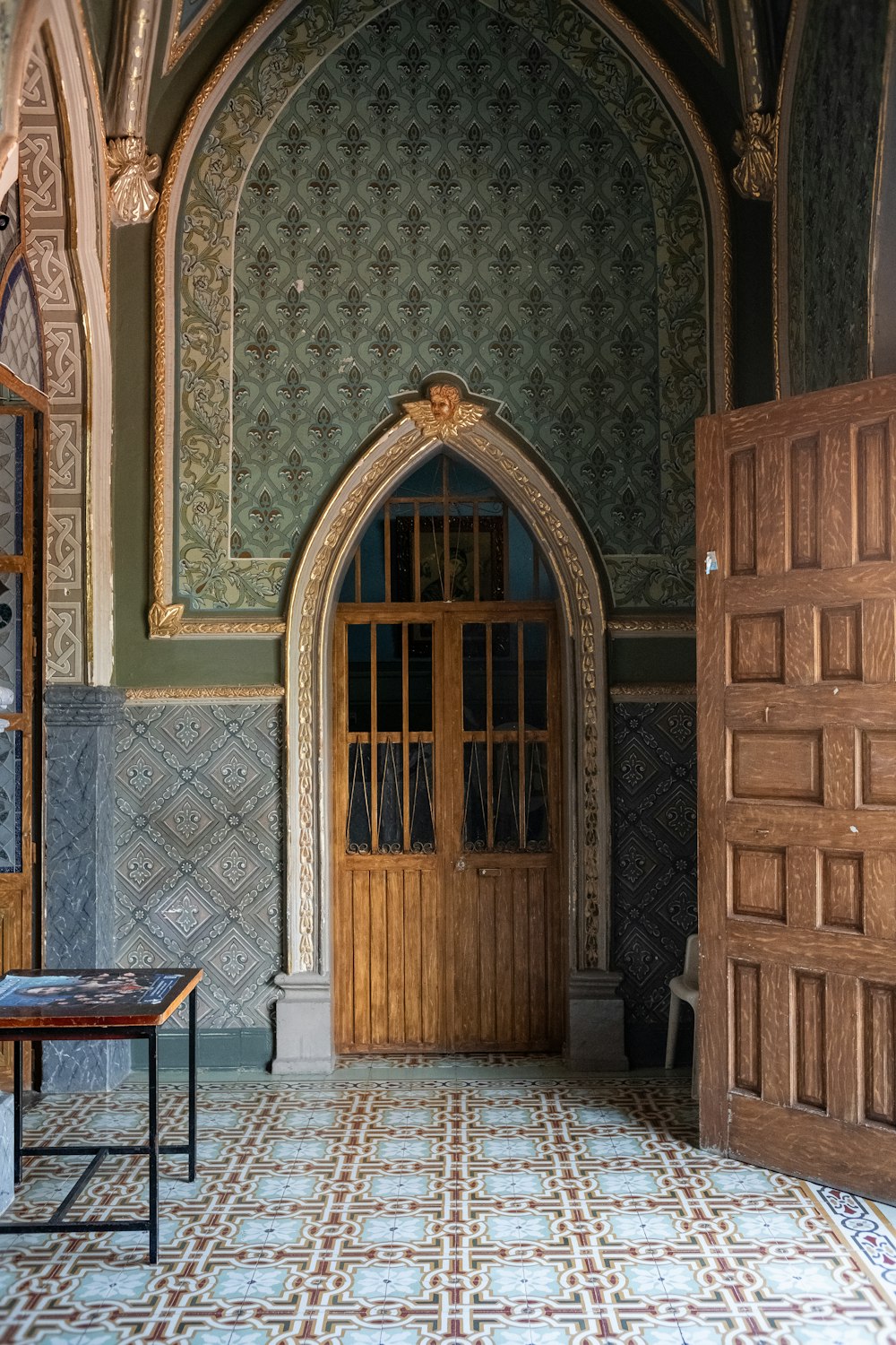 a room with a door and a table in it