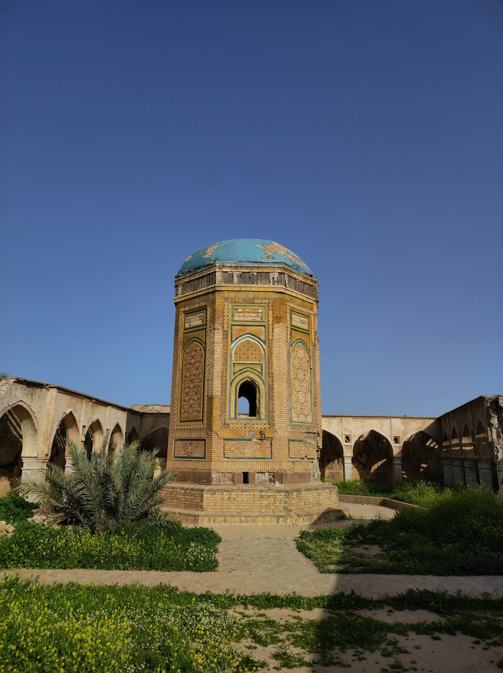 a small tower with a blue dome on top of it