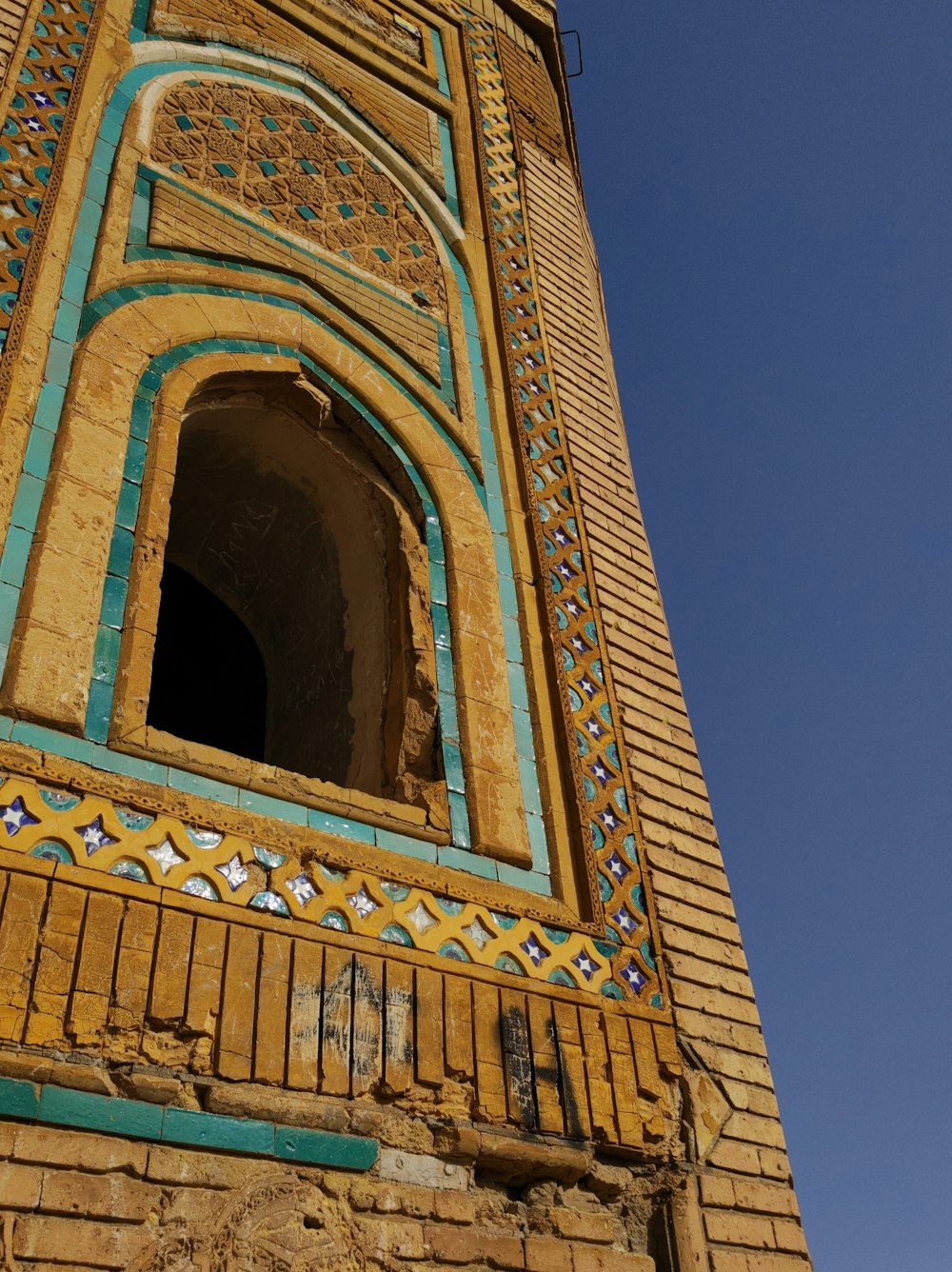 a tall tower with a clock on it's side