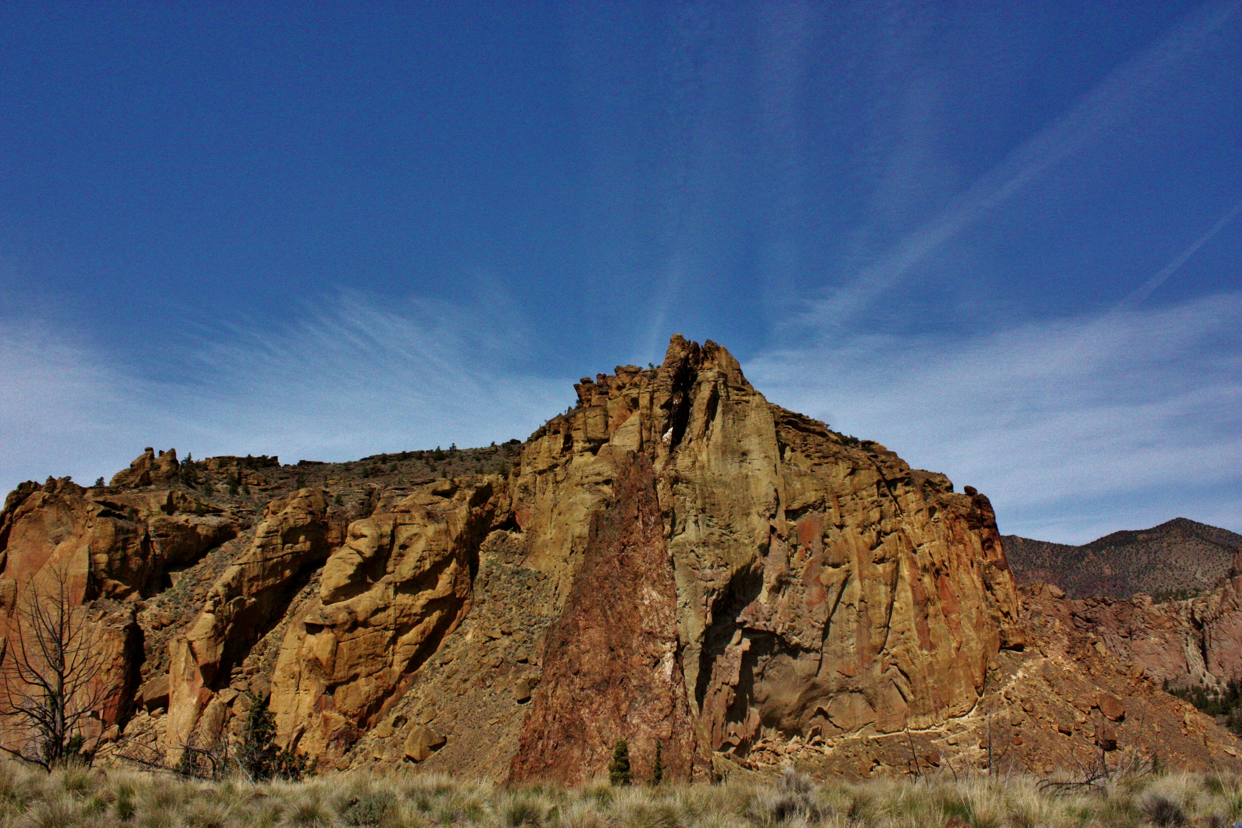 a large rock formation in the middle of a desert