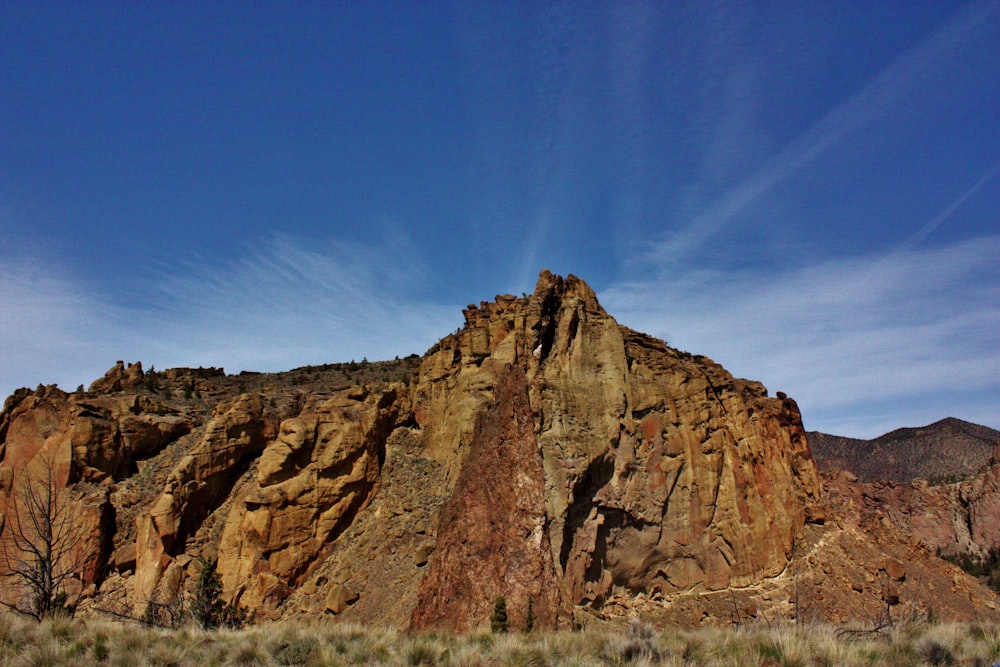 a large rock formation in the middle of a desert