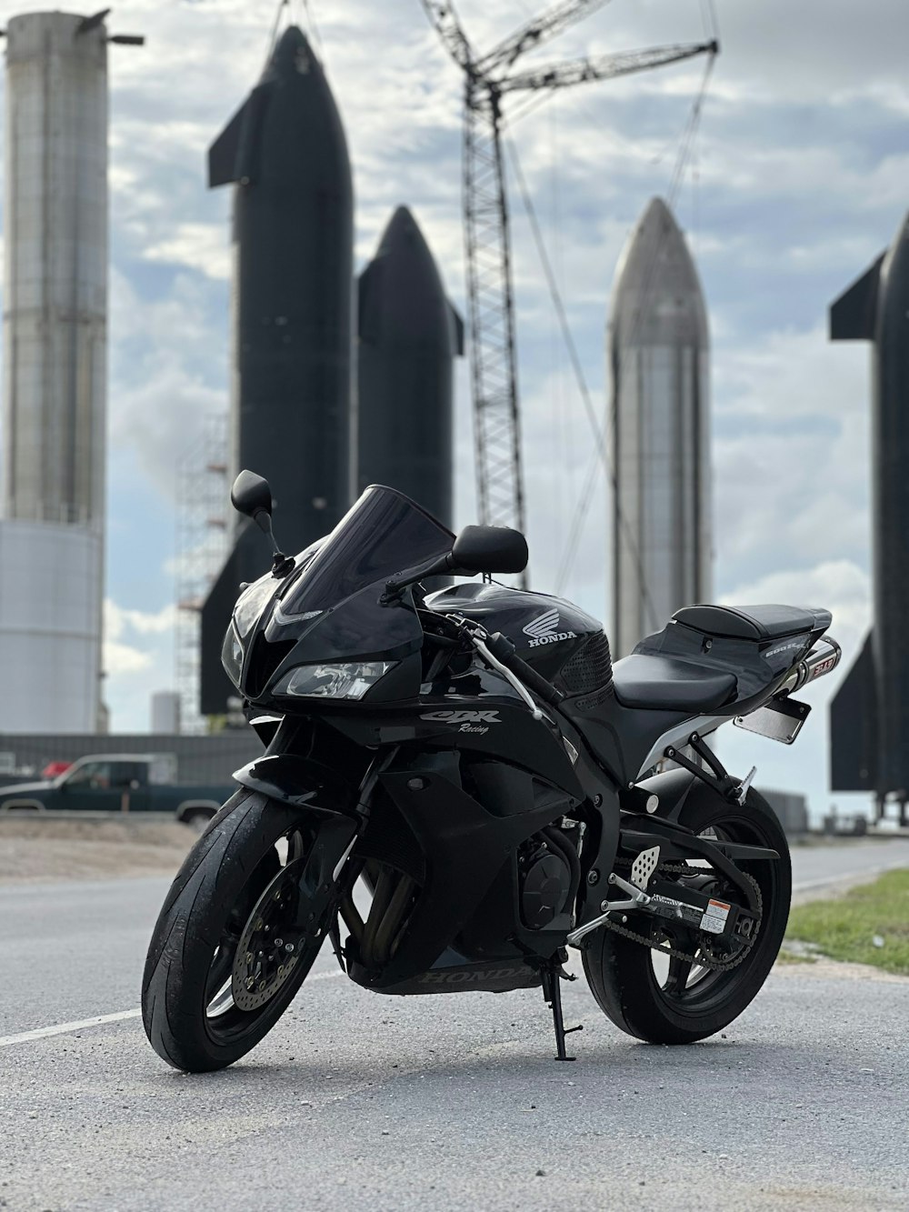 a black motorcycle parked on the side of the road