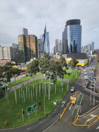 Modern city street with smart traffic lights and digital transport signage.