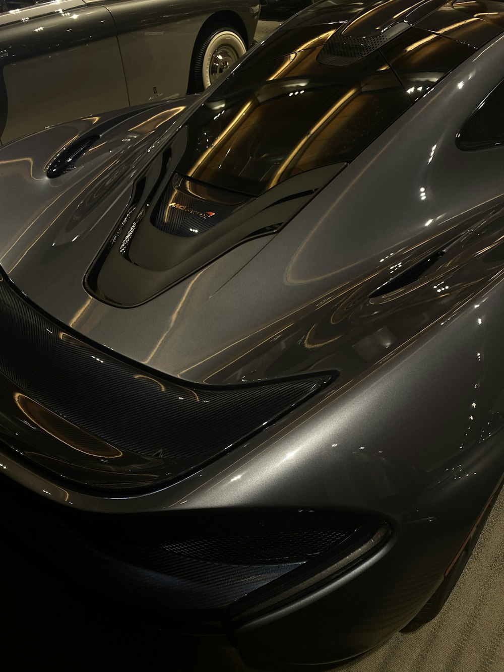 a black sports car parked in a garage