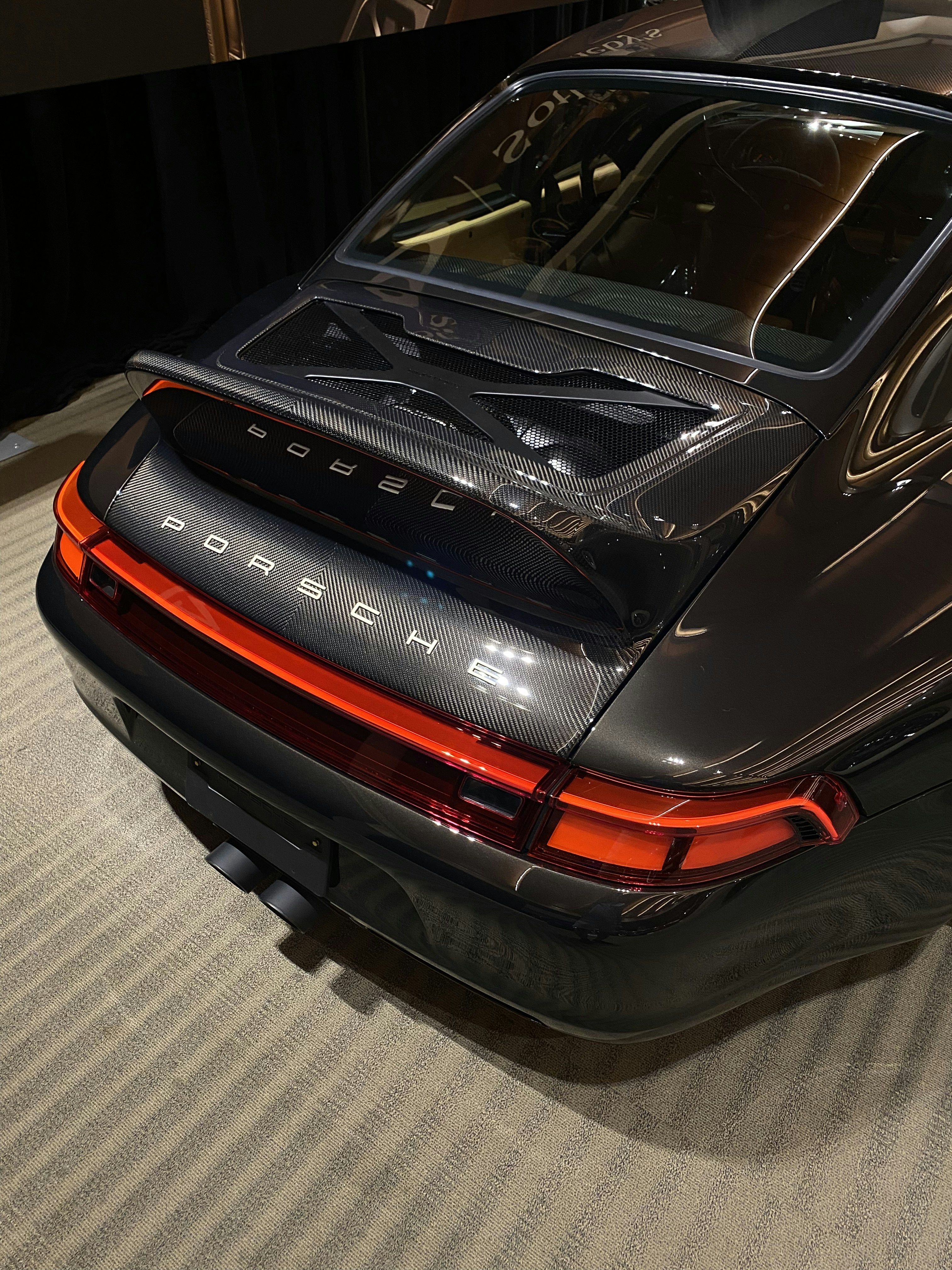 Rear view showing the iconic taillights of the Porsche 911.