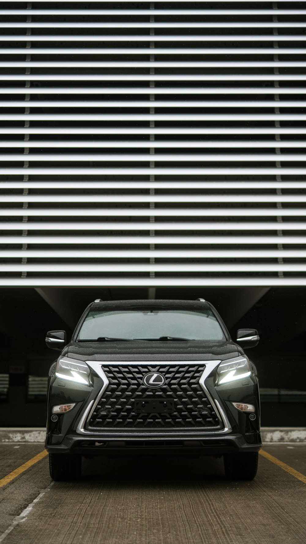 a black car parked in front of a building