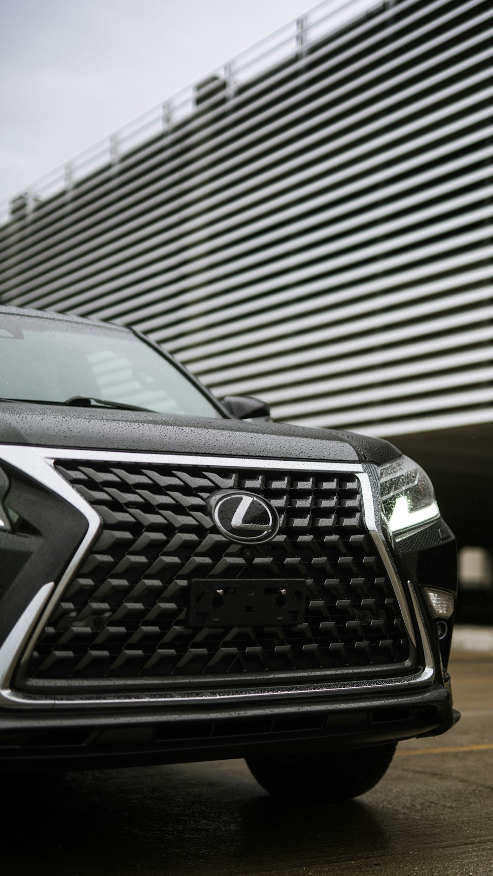 a close up of a car parked in front of a building