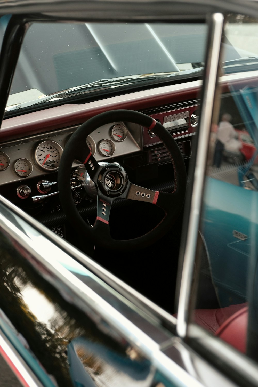 the interior of a car with a steering wheel and dashboard