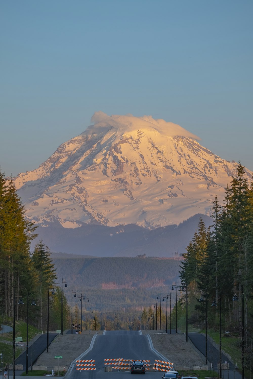 a large snow covered mountain in the distance