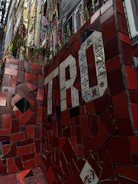 Mosaic tile wall art adding color and texture to a hotel lobby.