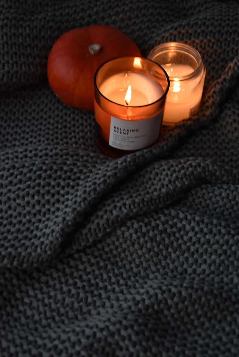 Two candles on a blanket