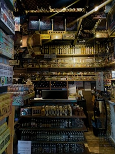 A well-organized beverage store interior with shelves stocked with various bottles and crates.