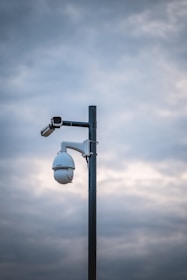 a street light with a camera attached to it
