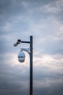 a street light with a camera attached to it