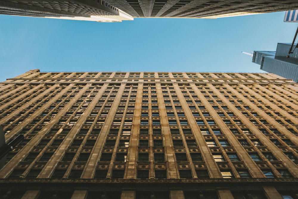 looking up at the top of a tall building