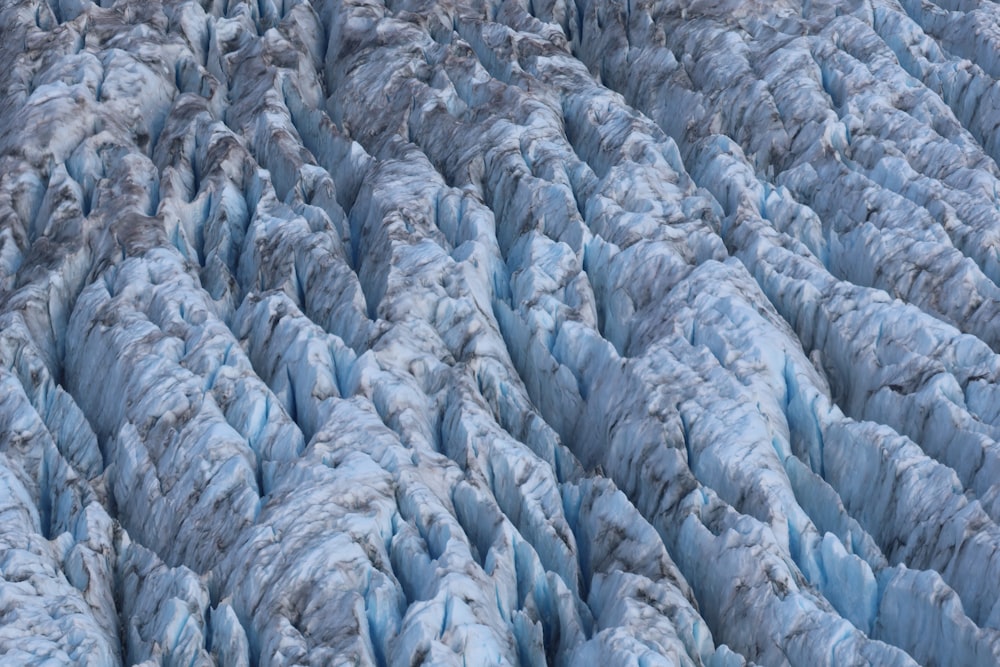 an aerial view of a glacier in the mountains