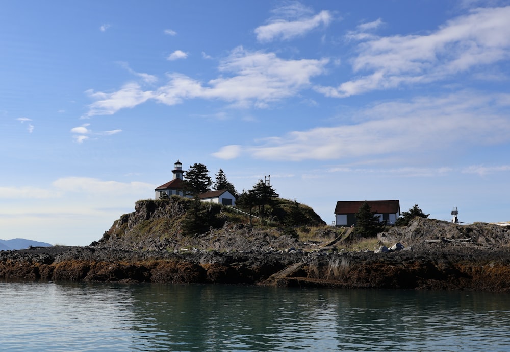 a small island with a house on top of it