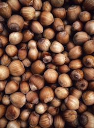 a pile of nuts that are brown in color