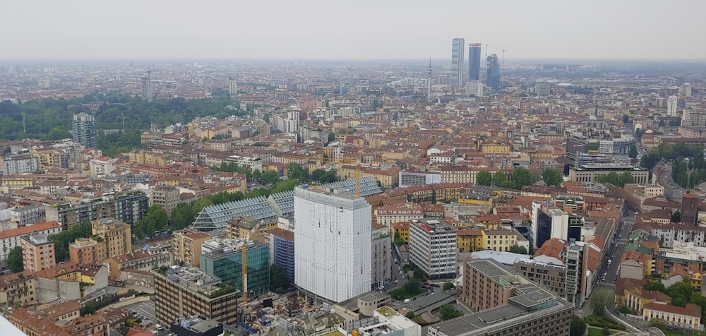 an aerial view of a city with tall buildings