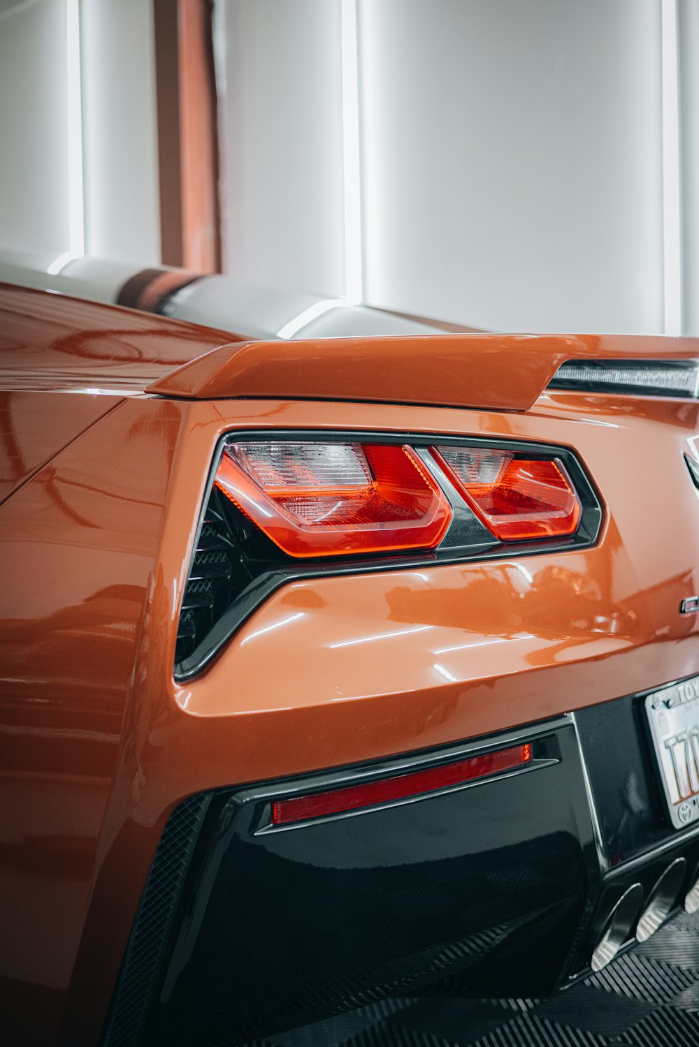 a close up of the tail lights of a sports car