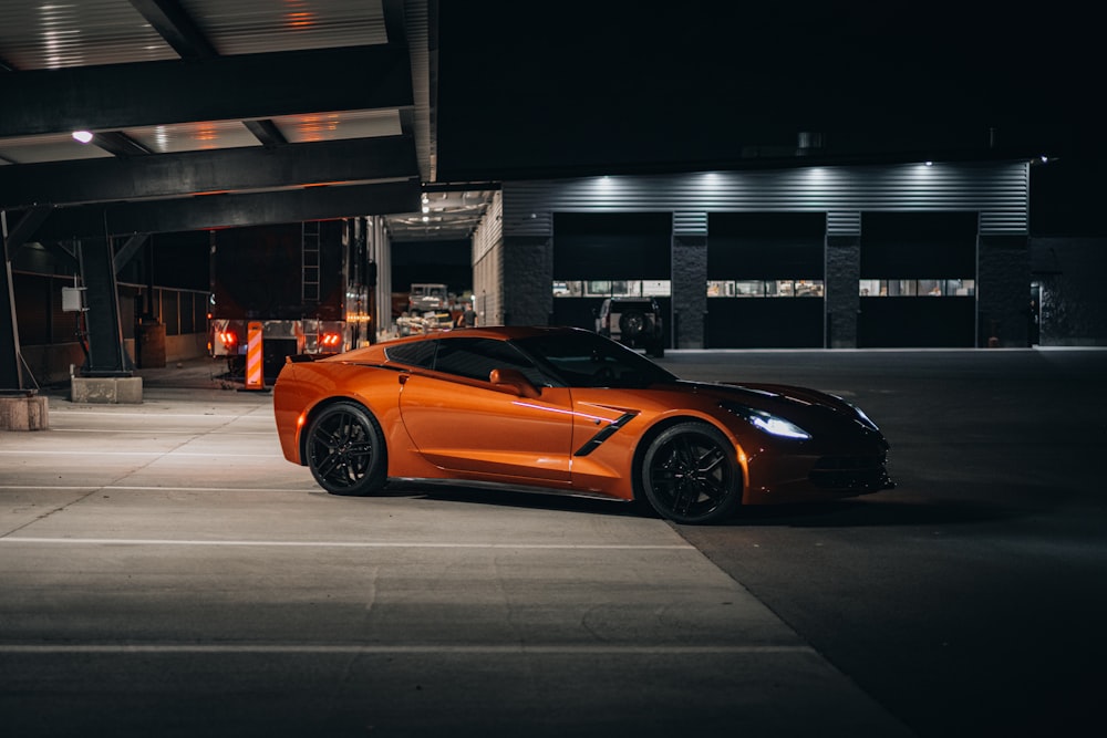 a car parked in a parking lot at night