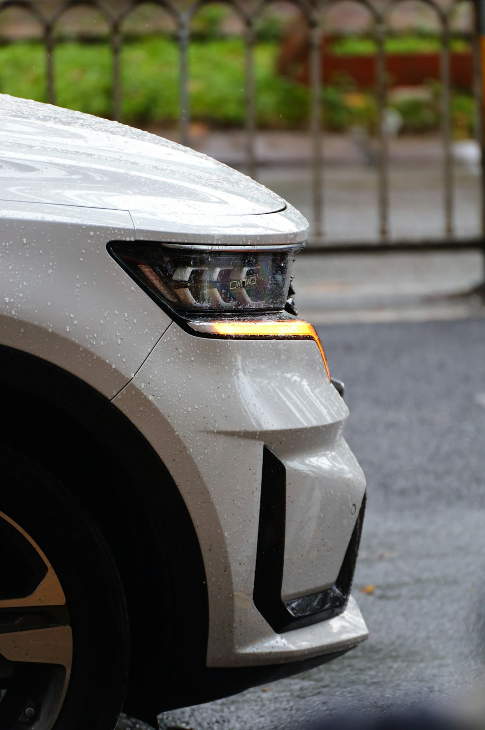 a close up of the front of a white car