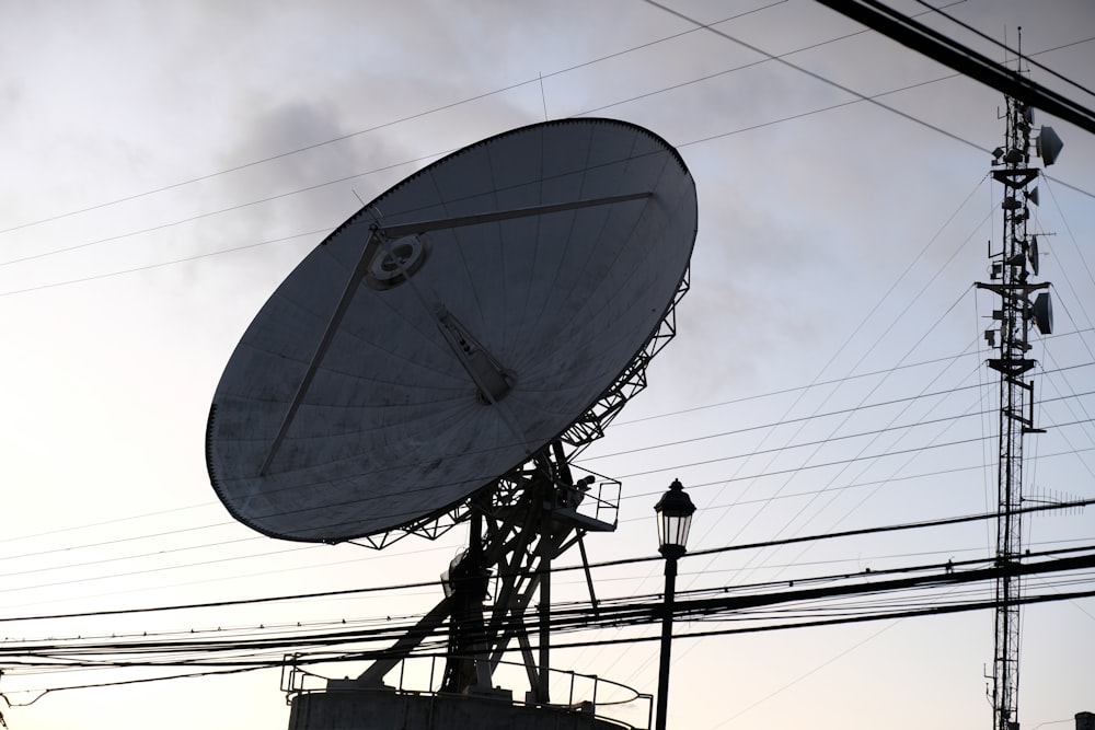 a large satellite dish sitting on top of a building