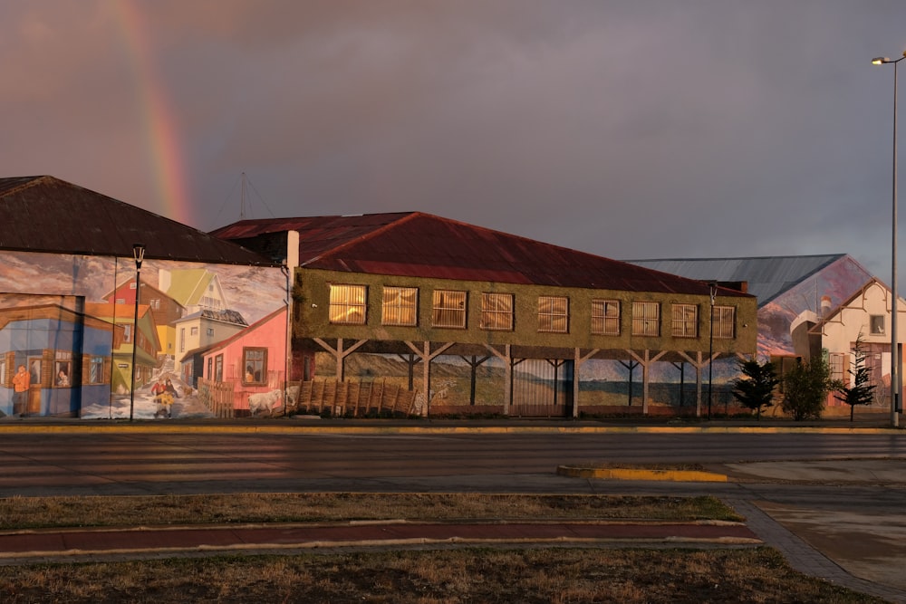 a building with a rainbow in the background
