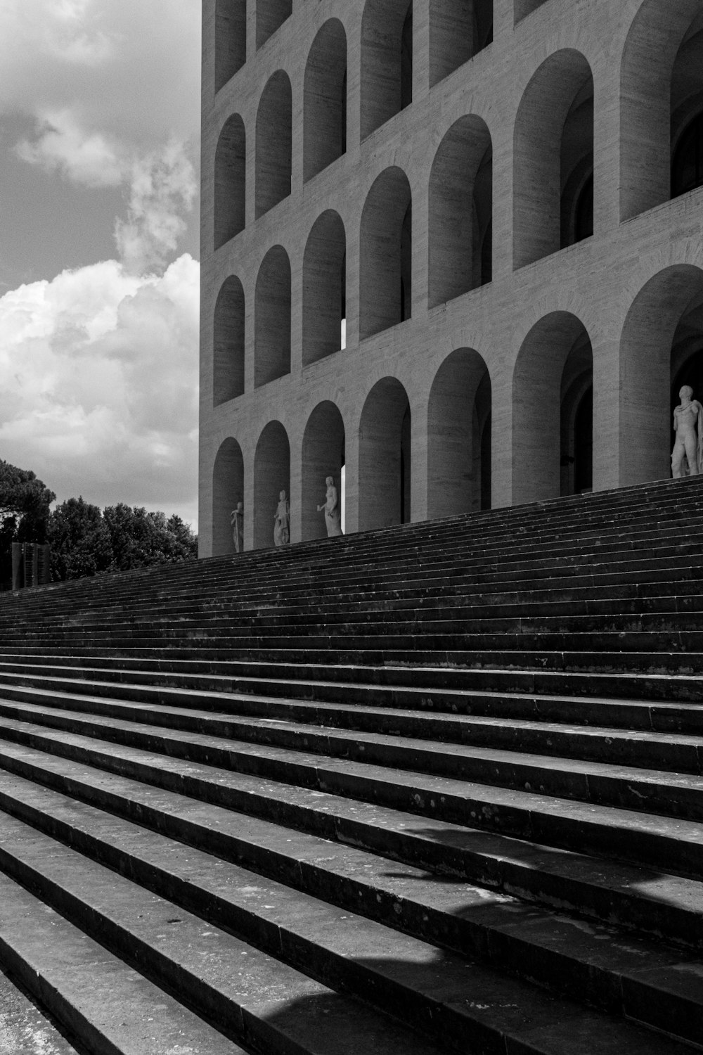 a black and white photo of steps leading to a building