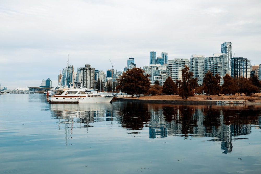 a boat in the water near a city