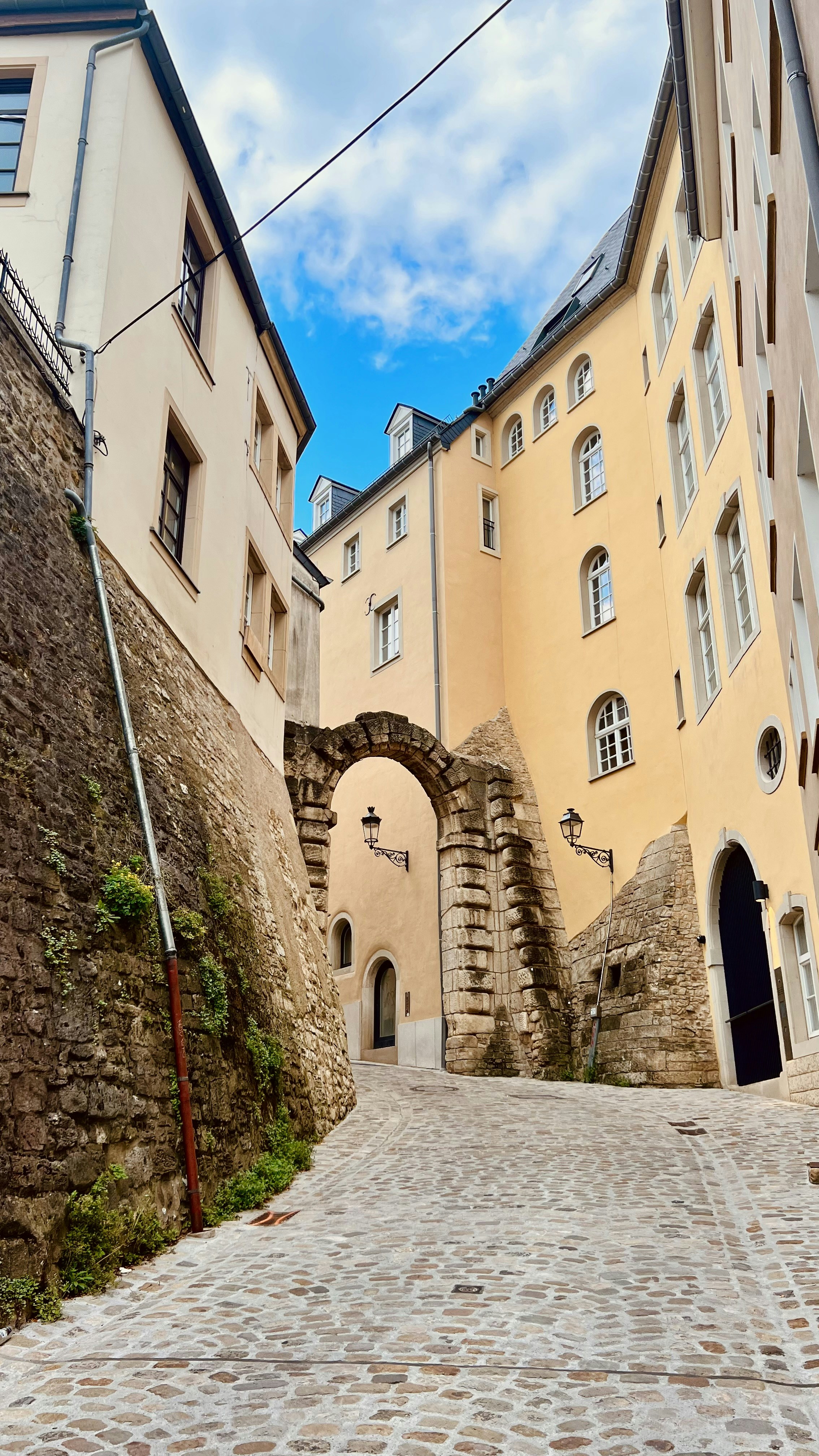 a cobblestone street in a european city