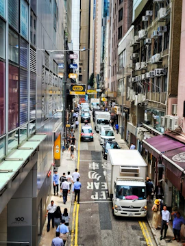 Engineer conducting drive testing in a bustling Latin American city.