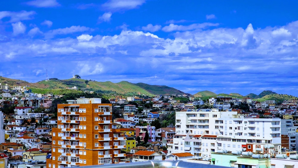 a view of a city with mountains in the background