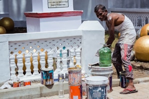 Freshly painted wall with painter's brush and color palette nearby