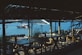 a restaurant with a boat in the water