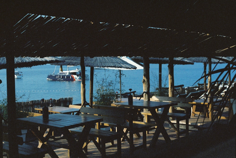 a restaurant with a boat in the water
