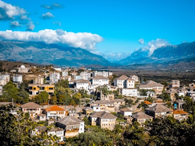a view of a city with mountains in the background