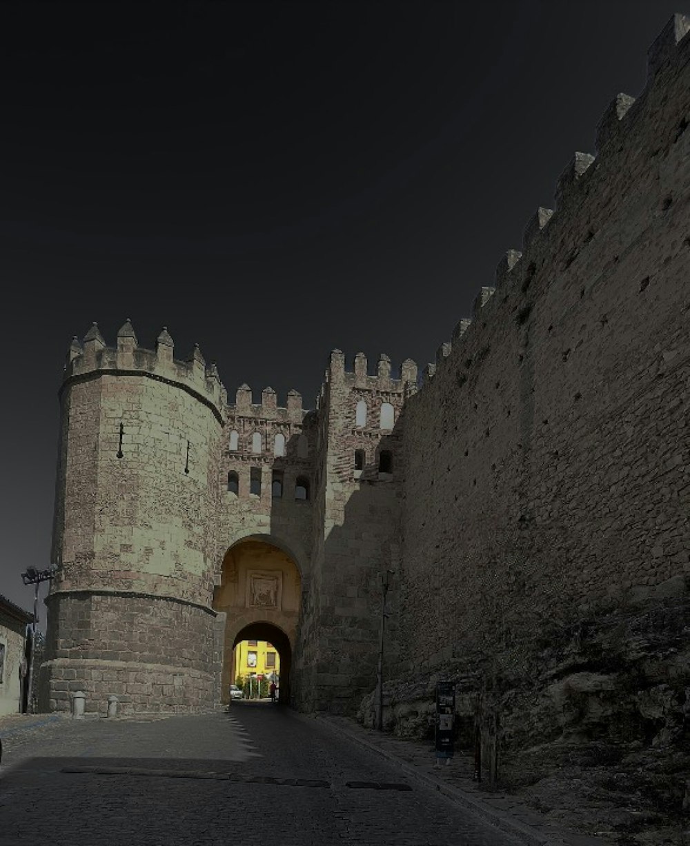 a large stone castle with a yellow door