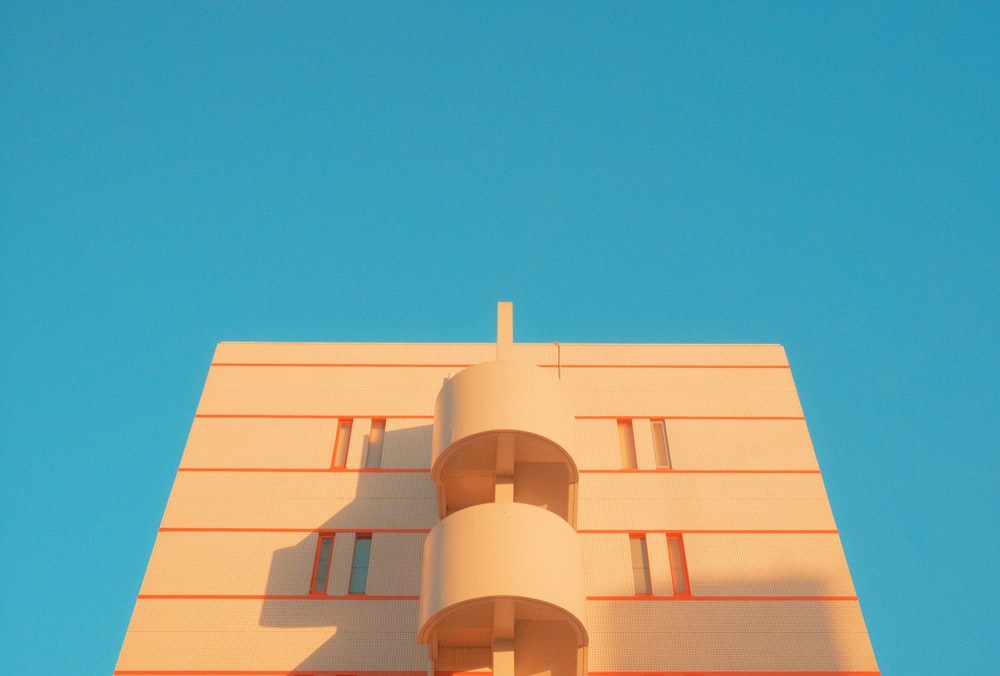 a tall building with a clock on the top of it