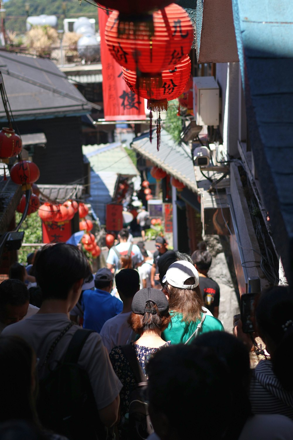 a crowd of people walking down a street