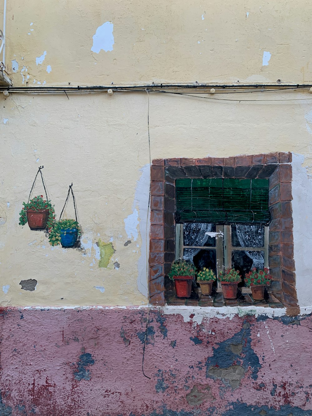 a window with a potted plant next to it