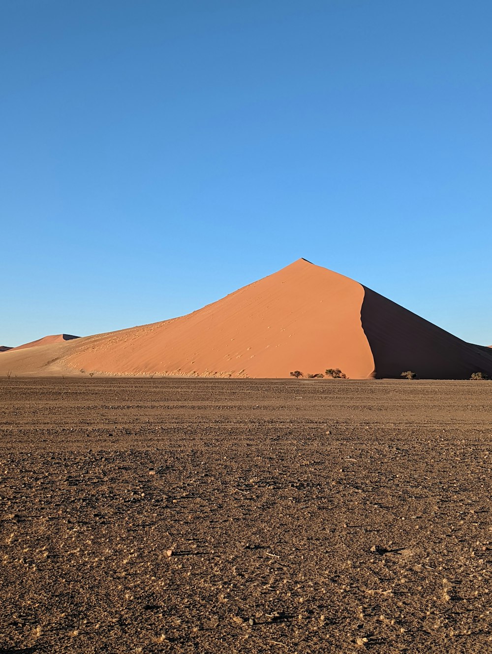 a large sand dune in the middle of a desert