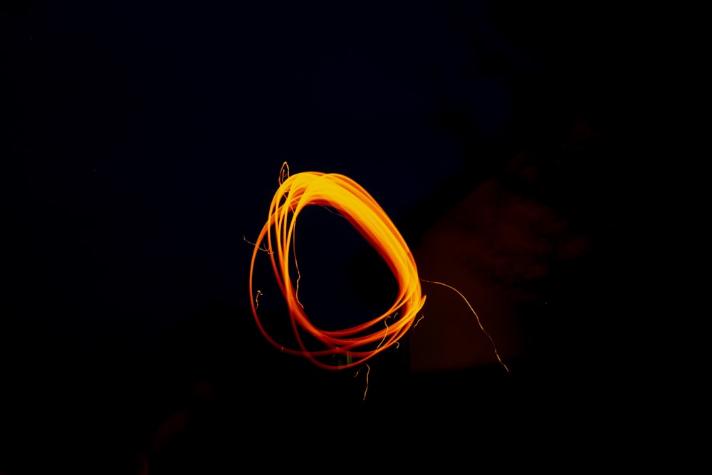 a long exposure of a fire hose in the dark