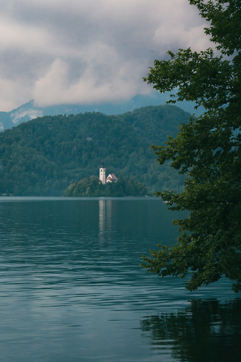 a church on a small island in the middle of a lake